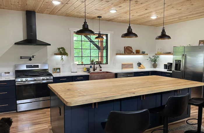 barndominium kitchen with navy cabinets